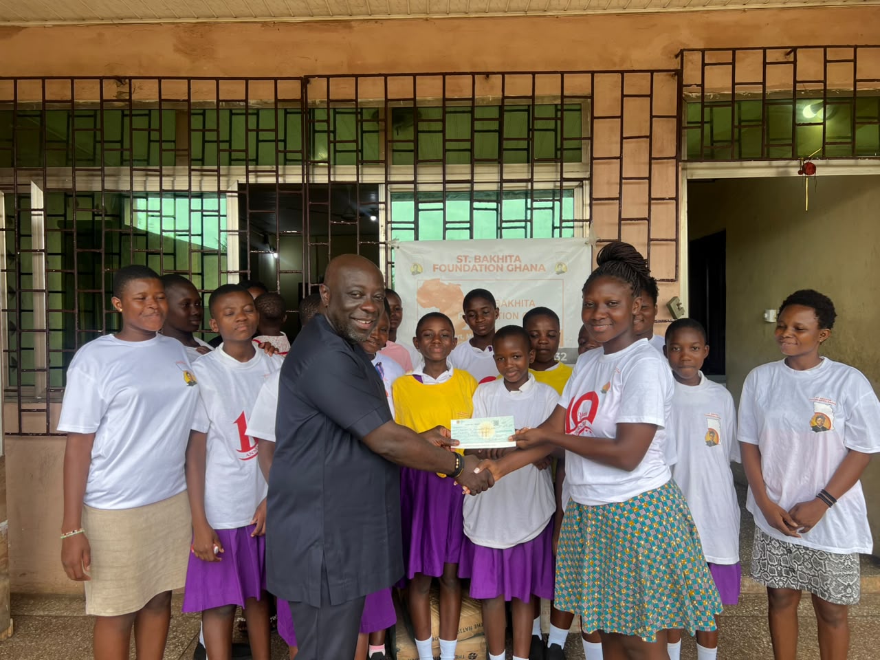 HOS Foundation presenting a donation cheque to St. Bakhita Foundation Ghana